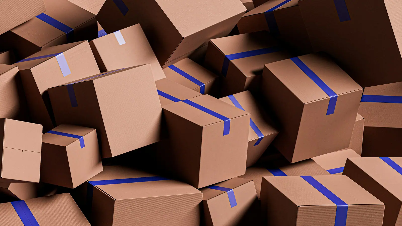 Pile of sealed cardboard parcels with blue tape